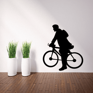 Vinyl wall decal of a black silhouette man riding a bicycle