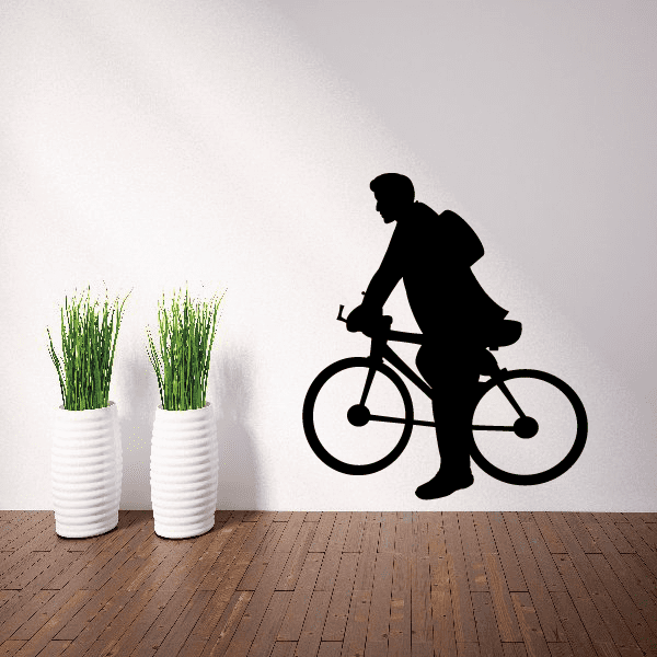Vinyl wall decal of a black silhouette man riding a bicycle