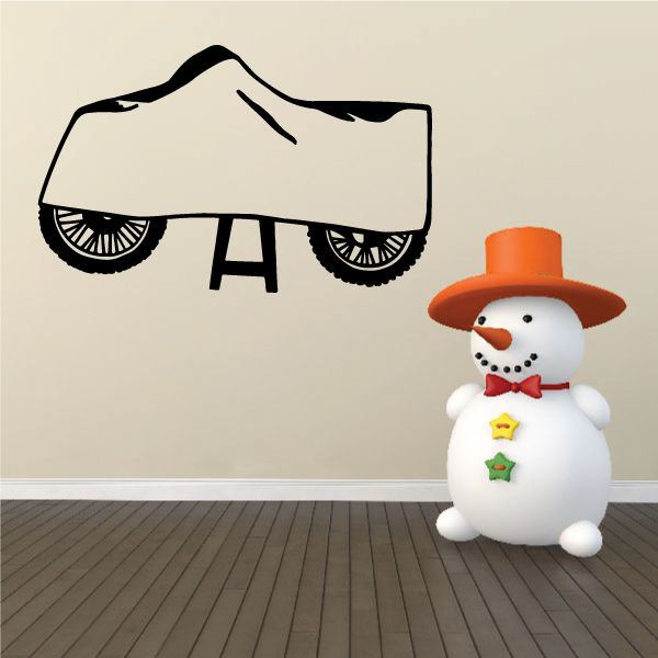 Dirt bike decal: black bike outline with snowman figure and orange hat