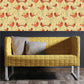 Elegant yellow sofa complemented by bird-inspired wallpaper