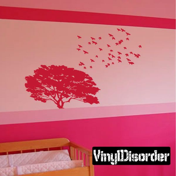 Red vinyl wall decal of a large tree with flocking birds in a sweeping arc