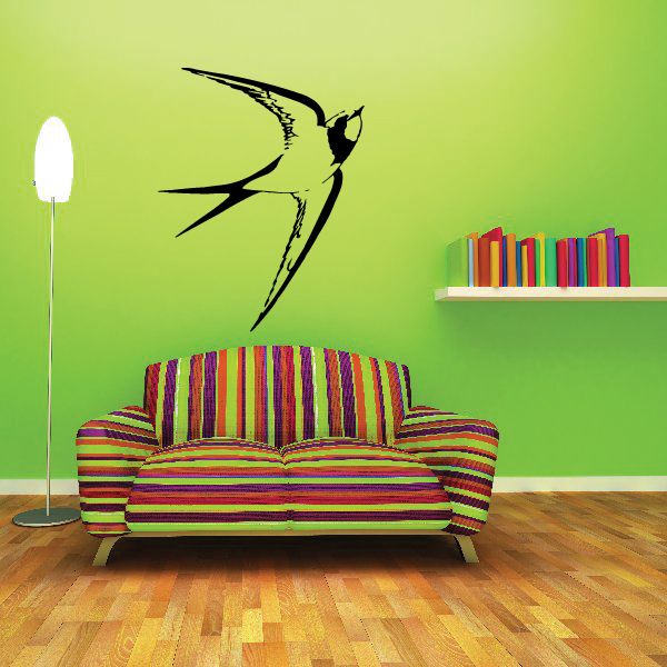 Black bird wall decal with sweeping wings and tail feathers