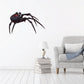 Crawling black spider vinyl sticker, dark body with red hourglass mark