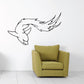 Dolphin wall decal in black line art with stylized wave tail