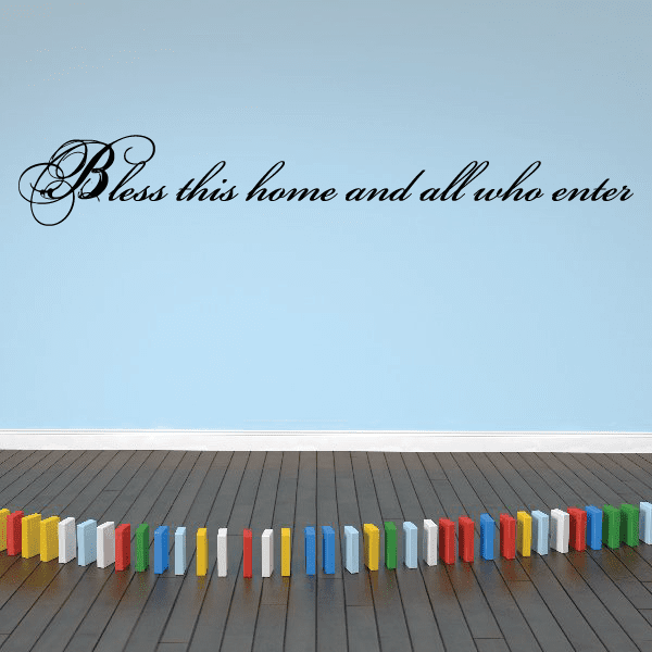 Wall decal with black cursive text: Bless this home and all who enter