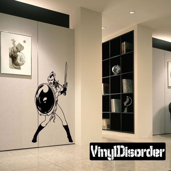 Warrior woman vinyl decal, black silhouette holding a sword and shield pose.