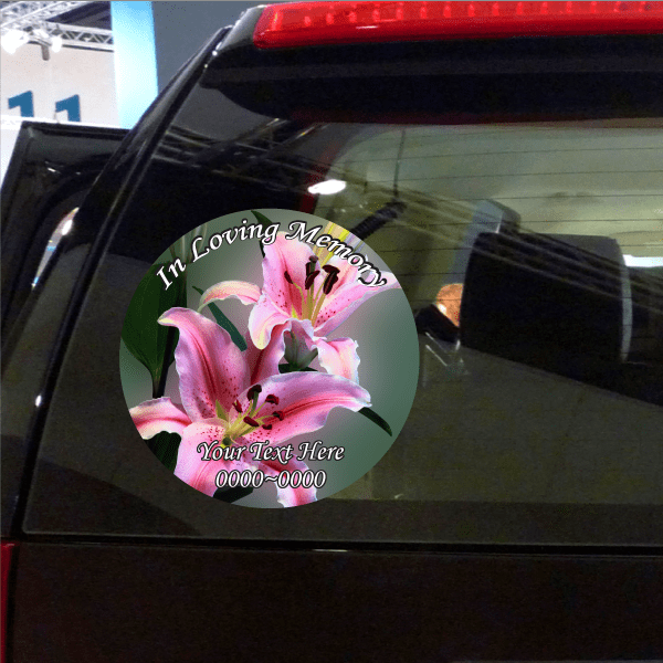 Round memorial flower sticker with pink lily and 'In Loving Memory' text