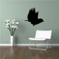 Black bird silhouette wall decal with wings spread in flight