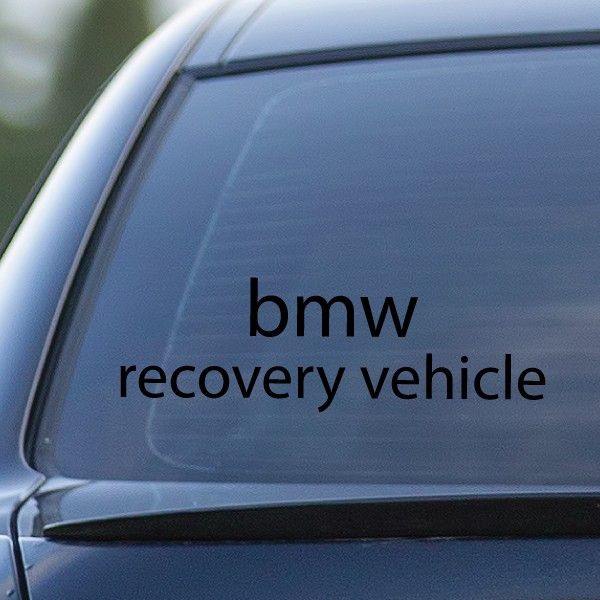 BMW recovery vehicle decal with black lettering on a car window