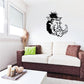 Black boar head decal with tusks, featuring detailed line art on a wall.