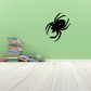Spider decal featuring a bold black spider silhouette on a smooth surface