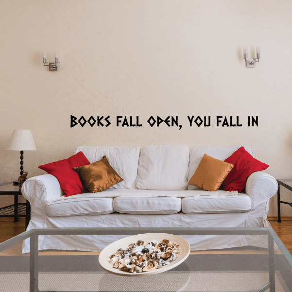 Wall decal with bold black quote: “BOOKS FALL OPEN, YOU FALL IN”
