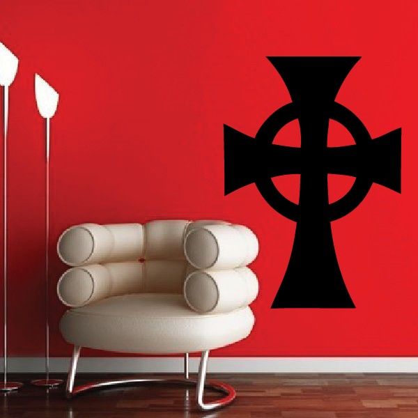 Black cross decal with circular knot design on a red surface