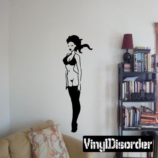 Vinyl wall decal of a woman in black stockings with long hair ponytail