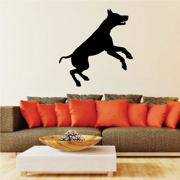 Bounding Doberman Pinscher decal, black silhouette of dog with raised front paw