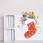 Printed die-cut Christmas stocking decal with red, green, and yellow festive flowers