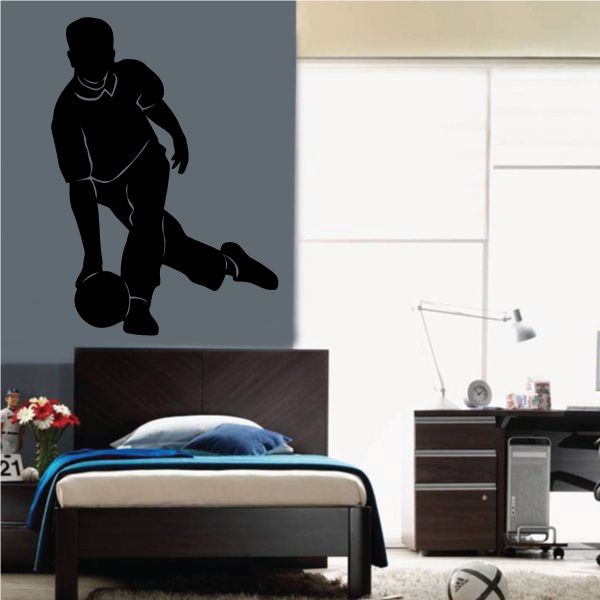 Bowling player decal showing silhouette holding a bowling ball in release stance