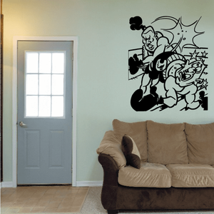 Boxing wall vinyl decal with cartoon fighter throwing punches and impact lines