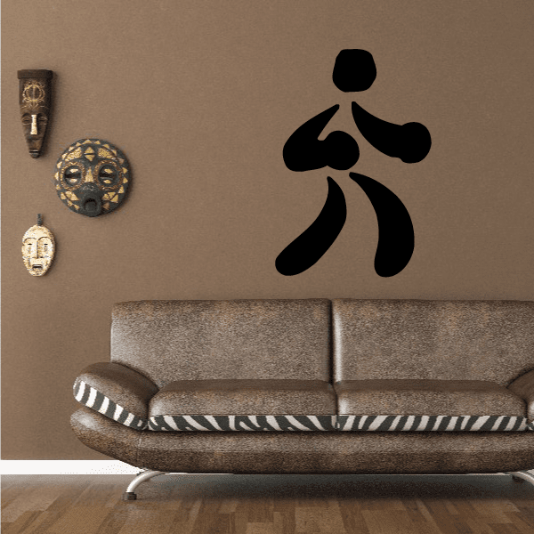 Black boxing wall decal vinyl sticker with raised glove silhouette on wall above sofa