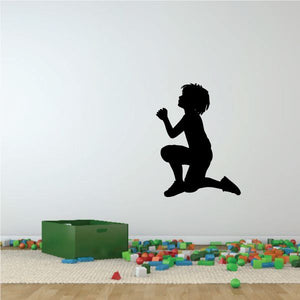 Kneeling boy praying wall decal silhouette
