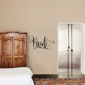 Bride script word decal in black, curved lettering on a wall
