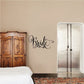 Bride script word decal in black, curved lettering on a wall