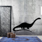 Black brontosaurus wall decal silhouette, side view with long neck and tail.