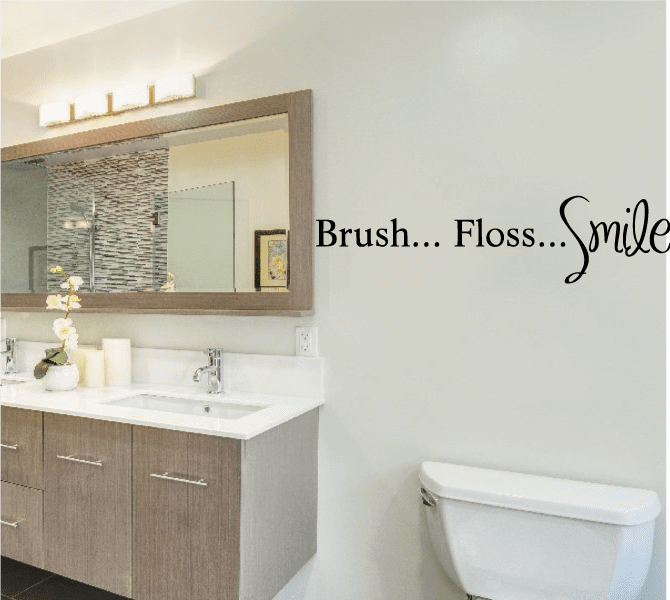 Bathroom wall decal text: Brush, Floss, Smile with cursive smile