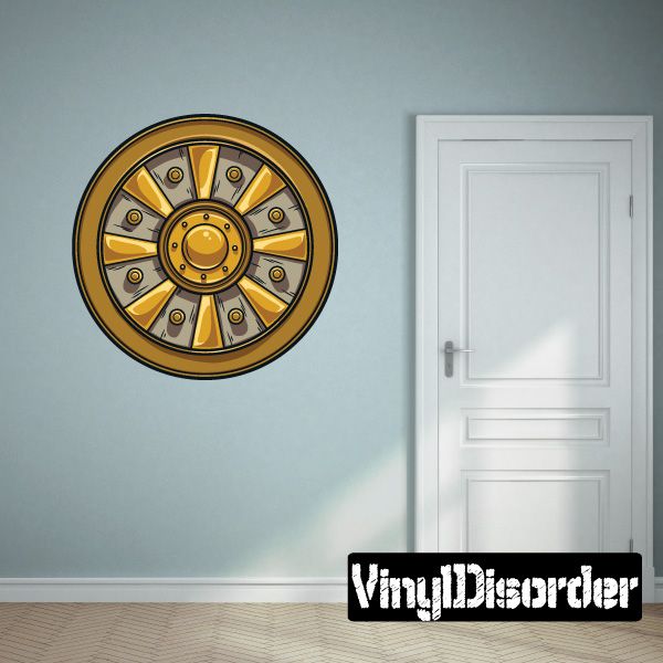 Circular shield emblem sticker with gold and gray radial shield design