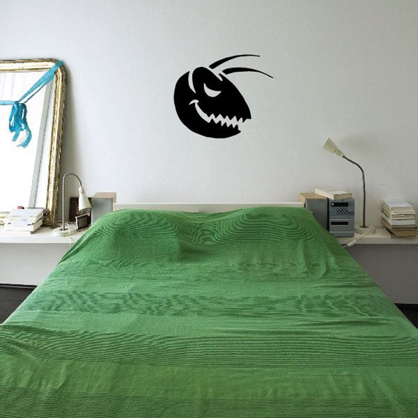 Black smiling bug head wall decal with curved antenna and whisker lines