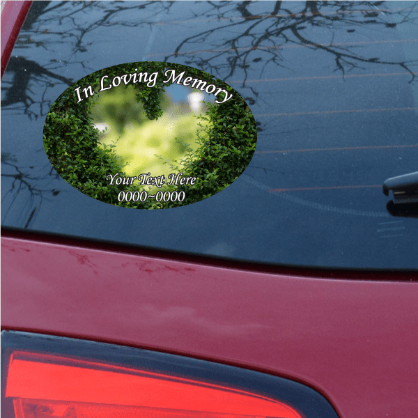 Round memorial heart sticker with green foliage, “In Loving Memory” and “Your Text Here”