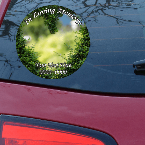 Circular memorial sticker with green heart wreath and 'In Loving Memory'