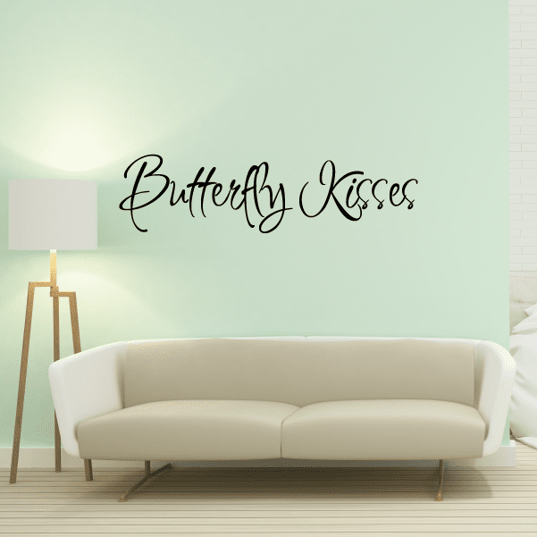 Butterfly kisses wall decal with black cursive lettering