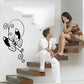 Butterfly vinyl wall decal, black and white with curled vines and wing detail