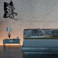 Black butterfly vinyl wall decal with dotted wings and curled antennae