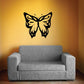 Butterfly wall decal vinyl with black and gold wing design, centered above sofa