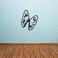 Butterfly wall decal, black vinyl outline with eye-like dots