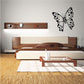 Black butterfly wall decal with white dot pattern and detailed wings