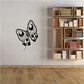 Butterfly wall decal in black vinyl with outlined wing details and antennae