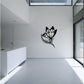 Black butterfly vinyl wall decal with curled wing and decorative trail