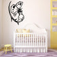 Butterfly wall decal with outlined butterfly and flower-like body, black and white