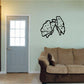 Butterfly vinyl wall decal with three black-outlined butterflies on a light wall