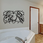 Black butterfly wall decal with ornate symmetrical wings above a bathtub