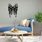 Black butterfly vinyl wall decal with decorative swirls and twig details