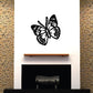 Black butterfly vinyl wall decal with detailed wings.