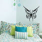 Black butterfly wall decal with ornate swirls and wings, vinyl adhesive sticker