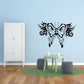 Black ornate butterfly wall decal with skull-like center and filigree wings.