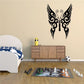 Butterfly wall decal with black wings and ornate white swirl details