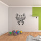 Butterfly wall decal with black swirling design on light surface