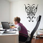 Black butterfly vinyl wall decal with ornate swirling lines